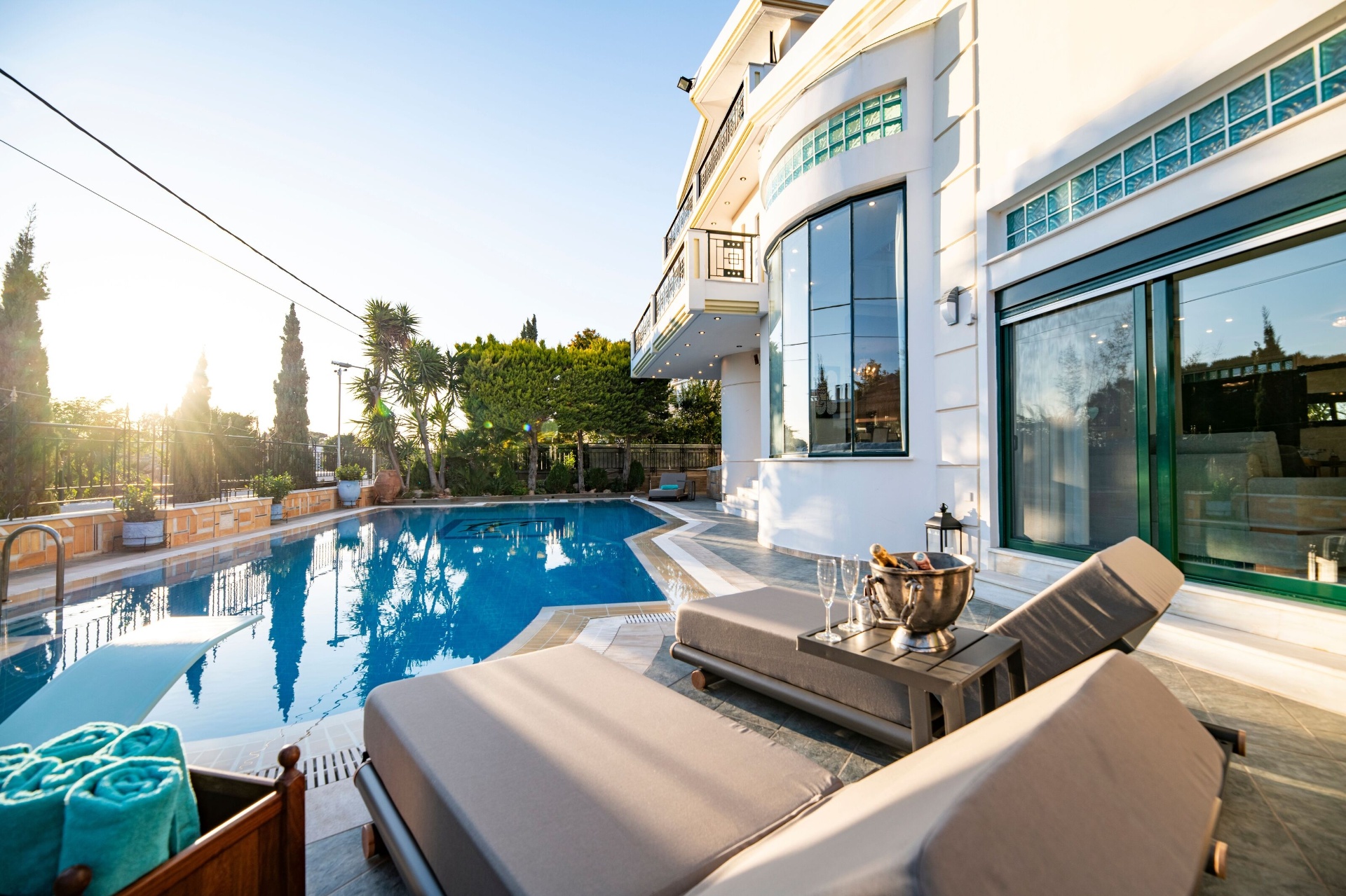 Villa exterior with pool in daylight
